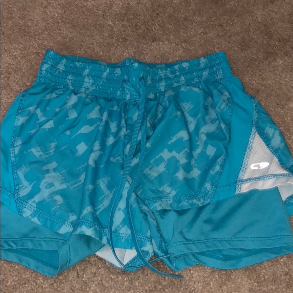 Blue athletic shorts with spandex shorts